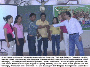 Board Member Ricardo Daiz congratulates Binay Barangay Chairman Roberto Orio.