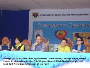 Onstage (left to right) DSWD Field Office Eight Director Leticia Diokno, Kawayan Mayor Gerardo Espina, Sr., Operations Division Chief Virginia Idano of DSWD Field Office Eight, and Land Bank Naval Branch Manager, all in a row.