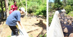 (Left Photo) Julie Pasaral points to where the water level reached during TS Yolanda. (Right Photo) The flood control sub-project kept Buaya residents safe from the ravages of flooding and of Typhoon Yolanda.