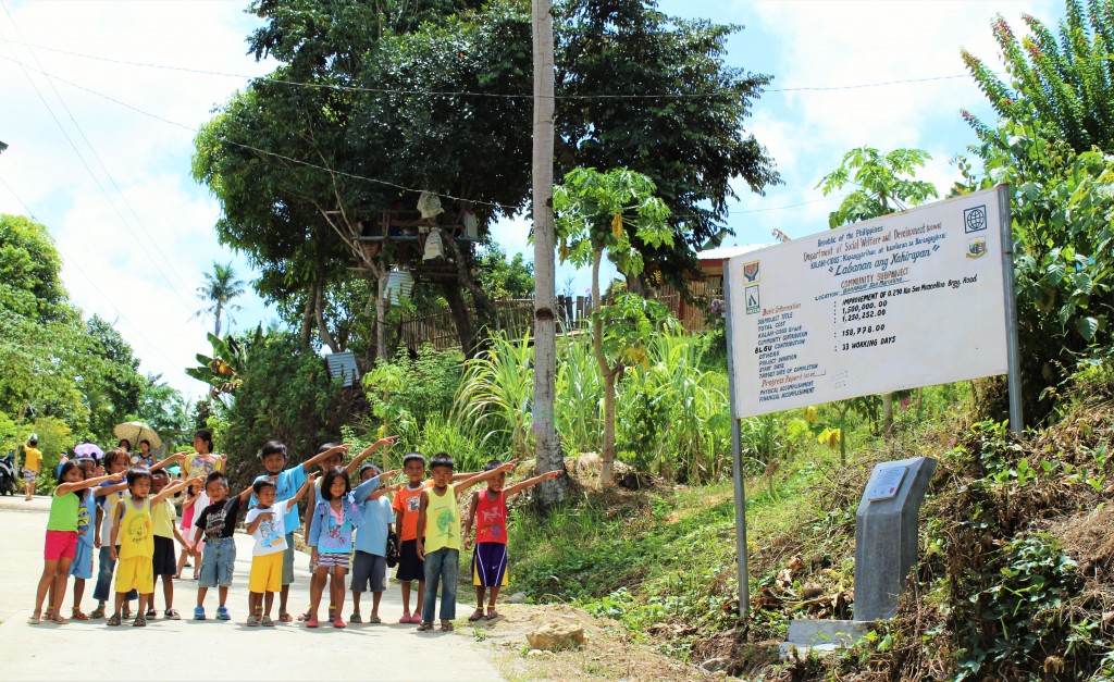 Proud children of San Marcelino happily boast their new concrete barangay road project implemented and constructed by their own parents and neighbors