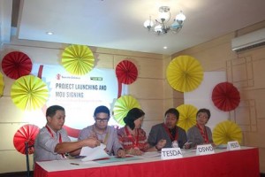 The first four partners sit down for the MOA signing.